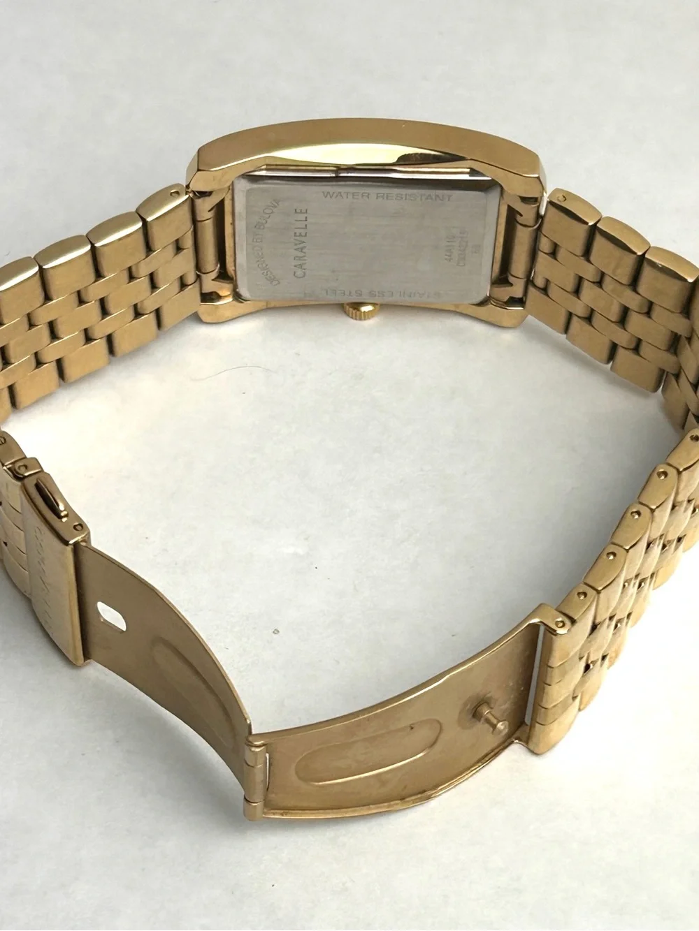 Caravelle by Bulova Men’s Gold Tone Rectangular Bracelet Watch Black dial 44A110